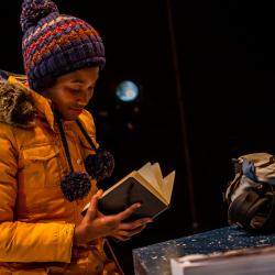 Satchel Williams reading in a production image for A Hundred Words for Snow. Photo: Ashley Smith of Wide Eyed Studios.
